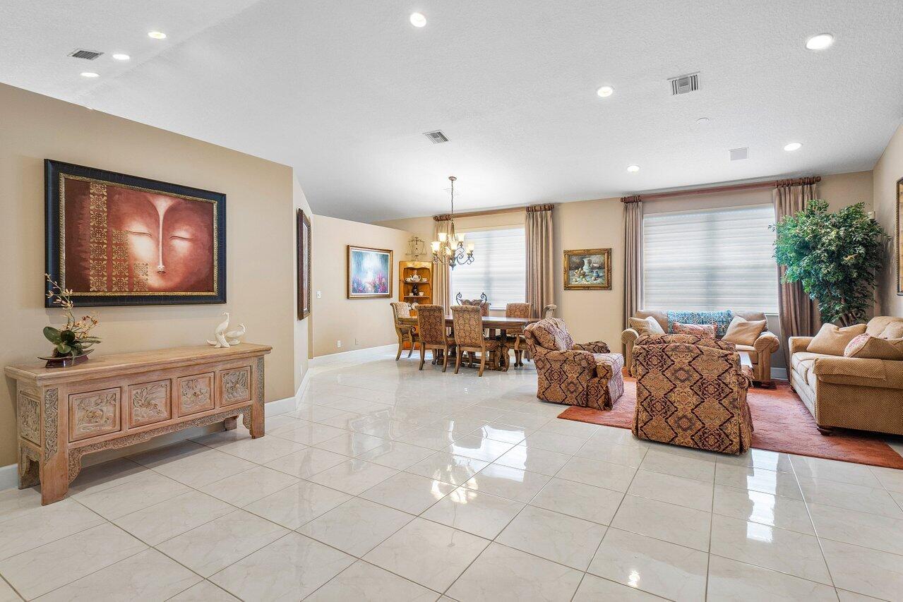 9031 Long Lake Palm Drive Boca Raton, FL 33496 - Photo 3 of 53 a living room with furniture and a flat screen tv