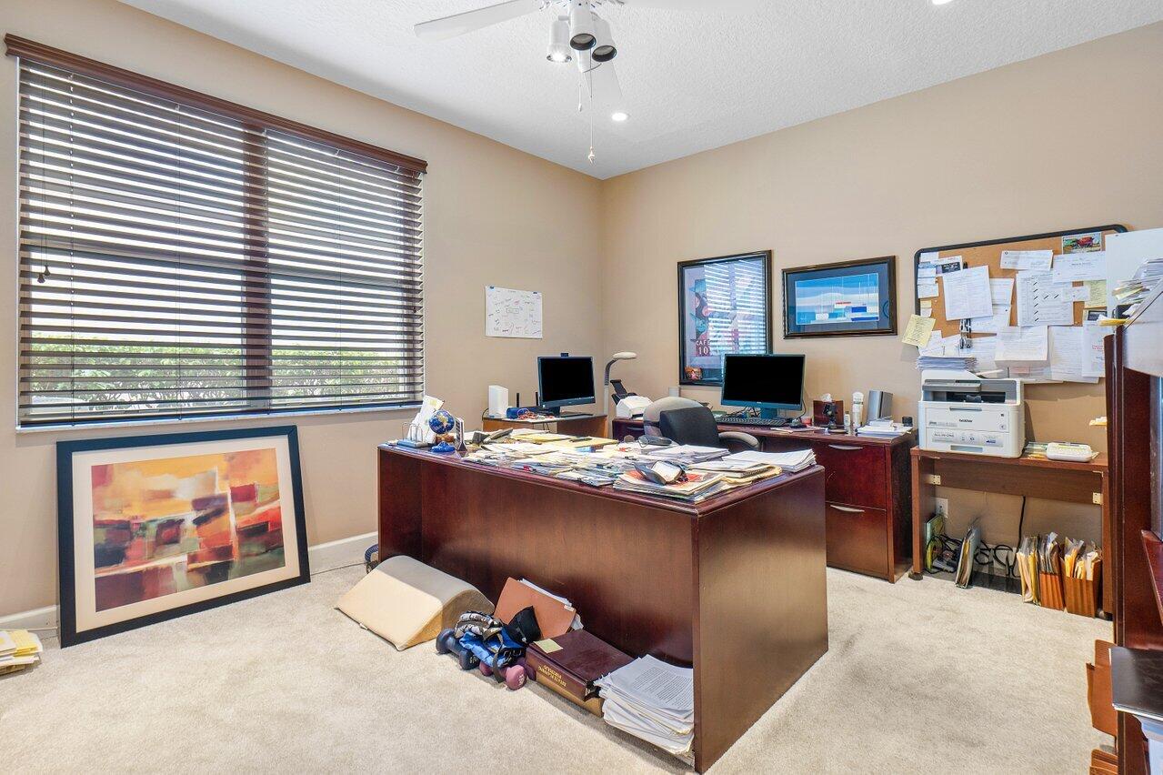 9031 Long Lake Palm Drive Boca Raton, FL 33496 - Photo 37 of 53 a view of a workspace with kitchen and dining table