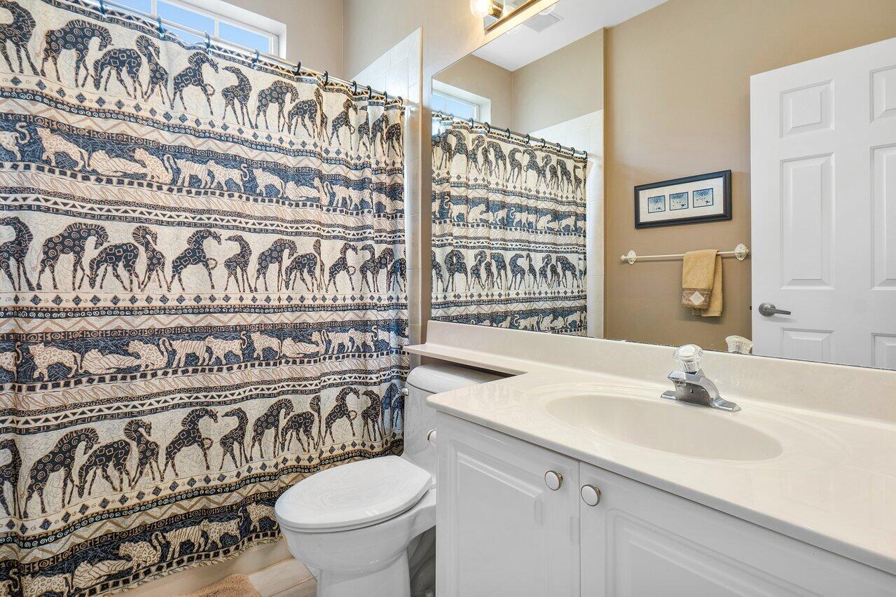 9031 Long Lake Palm Drive Boca Raton, FL 33496 - Photo 40 of 53 a bathroom with a sink and a toilet