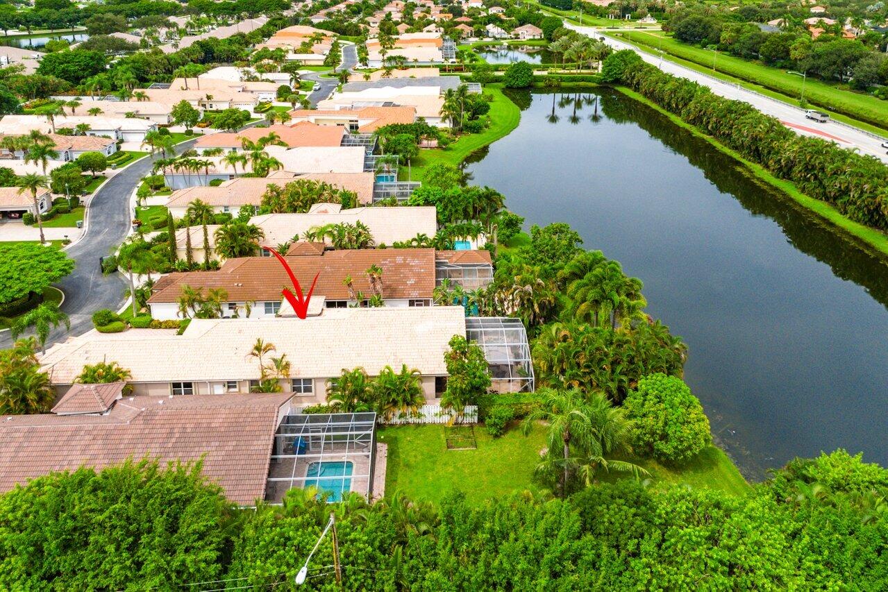 9031 Long Lake Palm Drive Boca Raton, FL 33496 - Photo 45 of 53 an aerial view of a house with a garden and yard