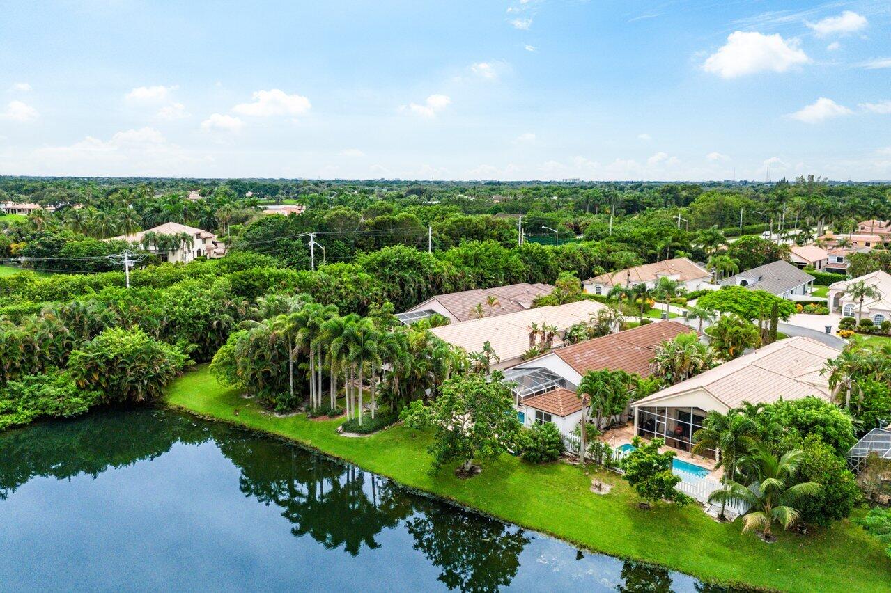9031 Long Lake Palm Drive Boca Raton, FL 33496 - Photo 48 of 53 an aerial view of a city with lots of green space