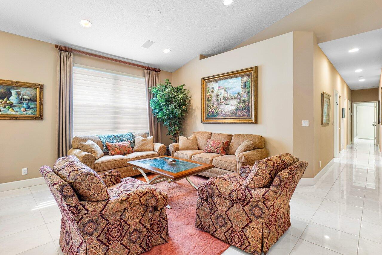 9031 Long Lake Palm Drive Boca Raton, FL 33496 - Photo 7 of 53 a living room with furniture and a large window