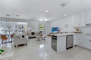 1401 Southwest 3rd Avenue Dania Beach, FL 33004 - Photo 13 of 13 a living room with furniture and a view of kitchen