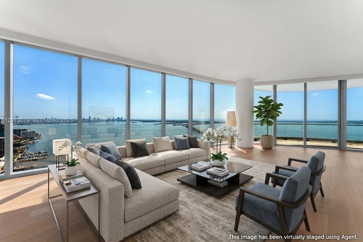 175 Southeast 25th Road, Unit 3601 Miami, FL 33129 - Photo 3 of 27 a living room with furniture and floor to ceiling windows
