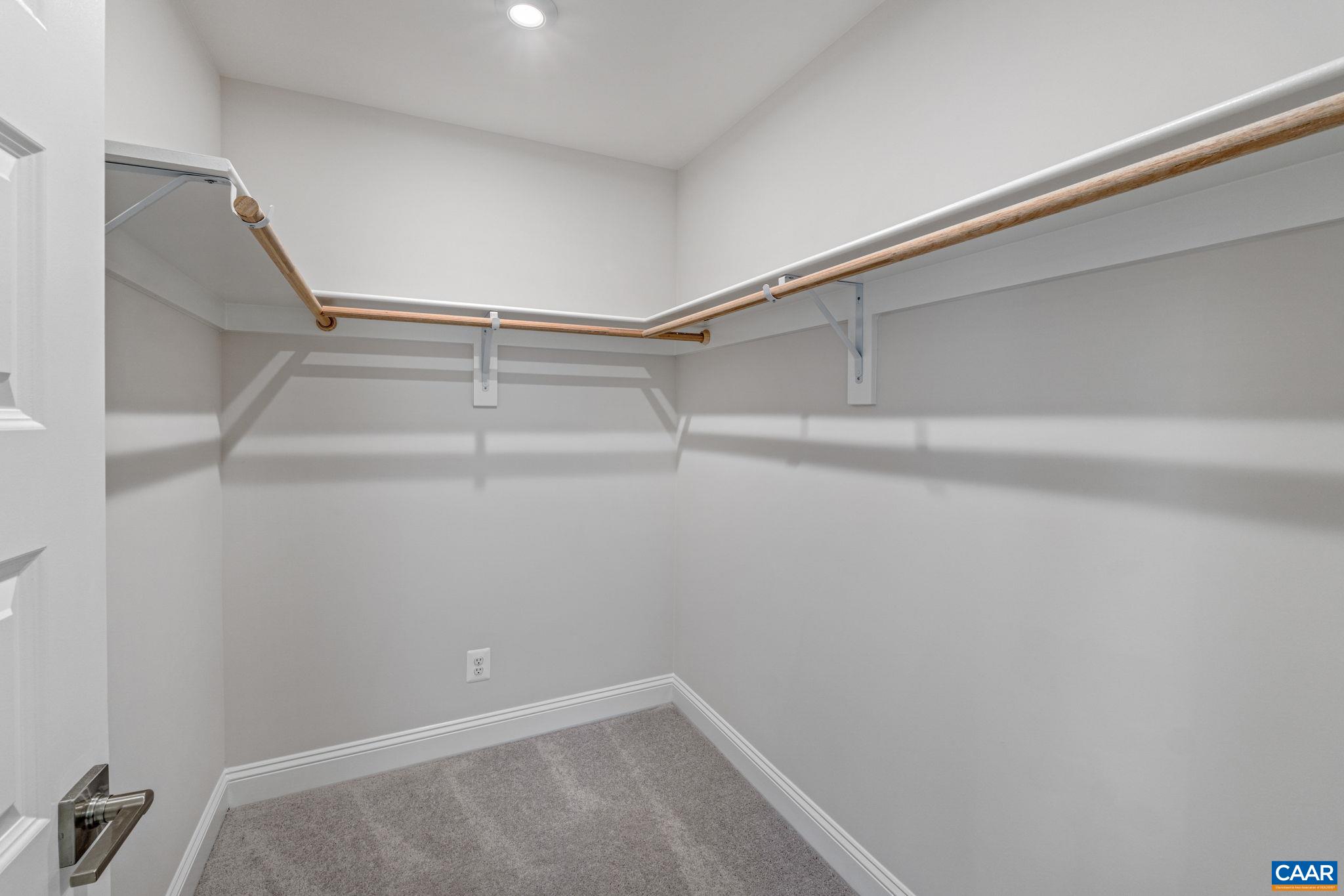 2237 Woodburn Road Charlottesville, VA 22901 - Photo 26 of 48 a view of a room with racks on the wall