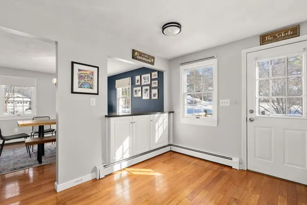 a view of a room with window and wooden floor