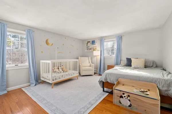a bedroom with a bed and a table in it
