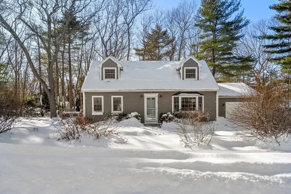 a front view of a house with yard patio and fire pit
