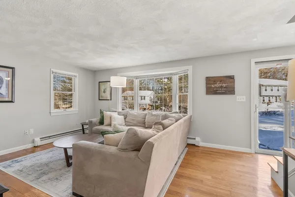 a living room with furniture and window