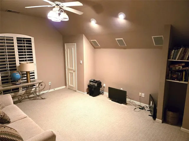 a bedroom with a bed gym equipment and a window