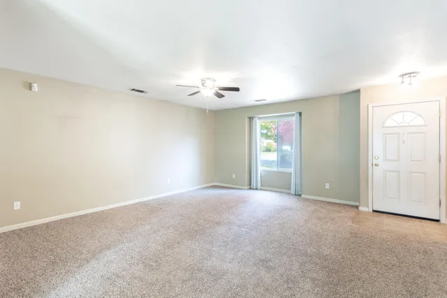 a view of an empty room with a window