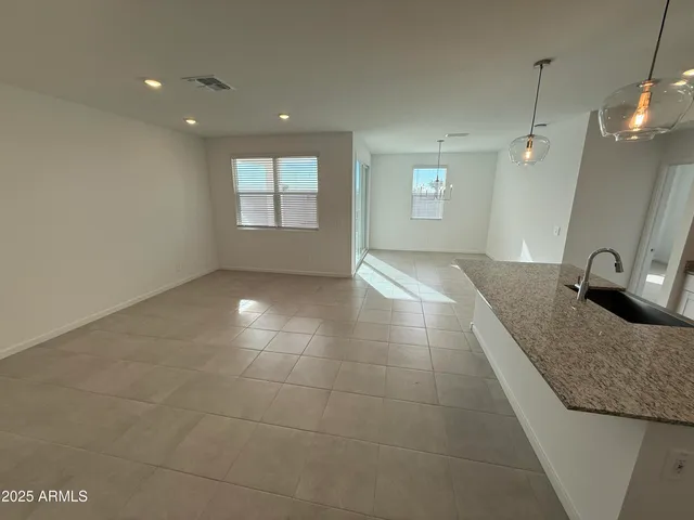 a close view of walk in closet with empty racks