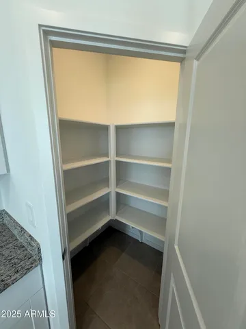 an empty room with a empty space and window