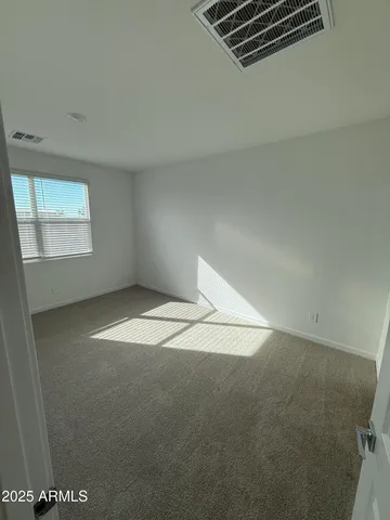 a white toilet sitting in a bathroom next to a sink