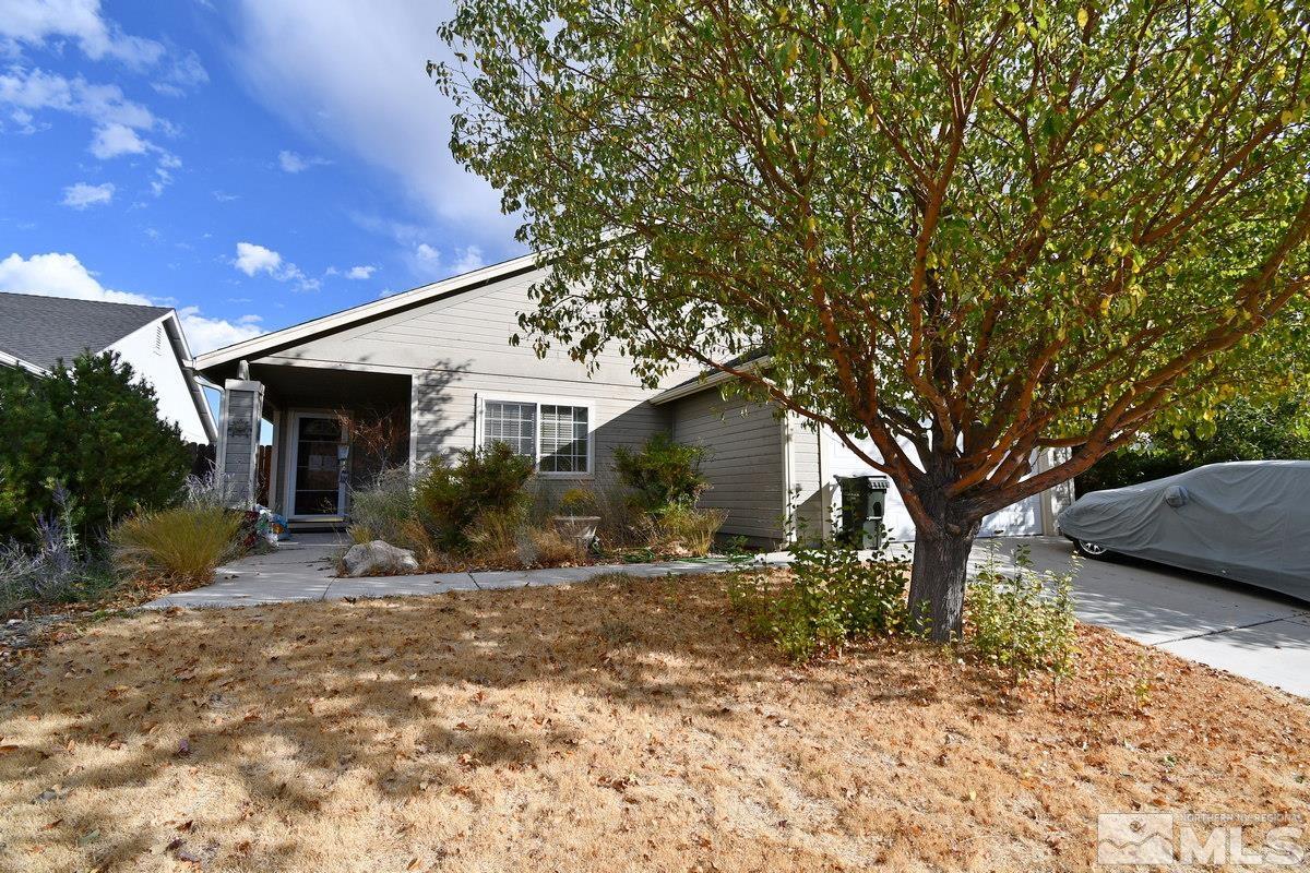 8 Conner Way Gardnerville, NV 89410 - Photo 4 of 6 a view of a house with a tree in the background