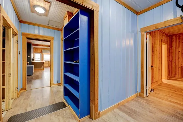 a view of walk in closet with empty room