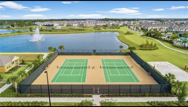 a view of a backyard with plants and a patio