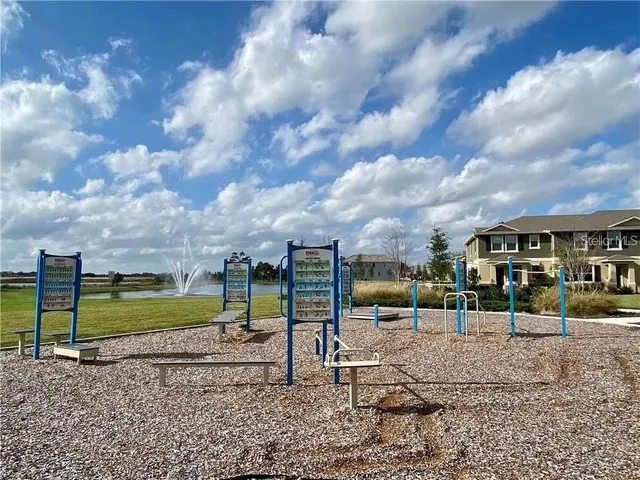 an aerial view of a residential houses with outdoor space
