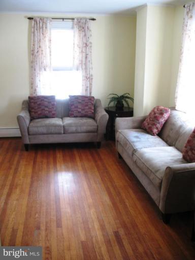 192 Hollen Road Baltimore, MD 21212 - Photo 14 of 20 a living room with furniture and a wooden floor