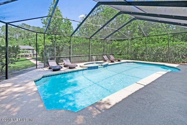 11766 Mandarin Road Jacksonville, FL 32223 - Photo 16 of 20 a view of a backyard with a garden and trees
