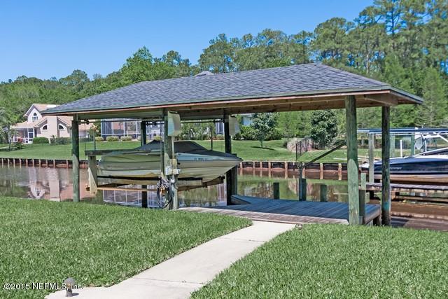 11766 Mandarin Road Jacksonville, FL 32223 - Photo 20 of 20 a view of a house with backyard and a hammock
