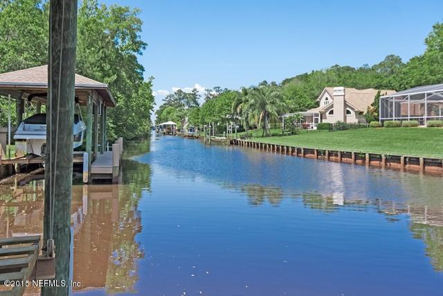 11766 Mandarin Road Jacksonville, FL 32223 - Photo 2 of 20 a view of a lake with a garden