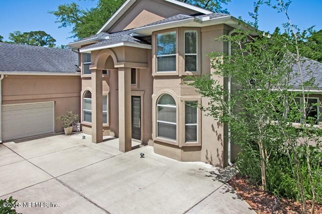 11766 Mandarin Road Jacksonville, FL 32223 - Photo 3 of 20 front view of a house with a porch