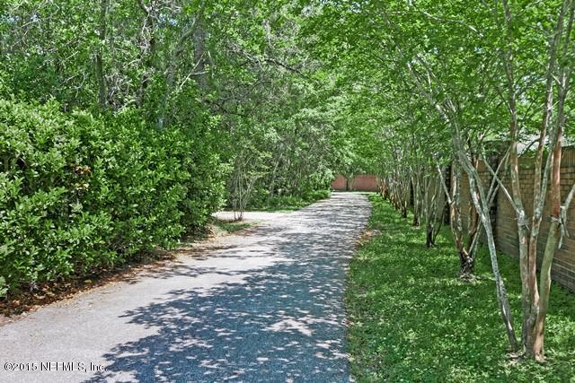 11766 Mandarin Road Jacksonville, FL 32223 - Photo 4 of 20 a view of green field with trees in the background