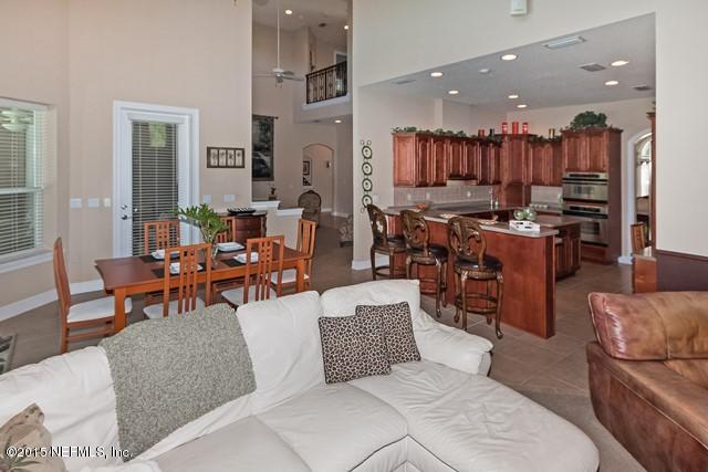 11766 Mandarin Road Jacksonville, FL 32223 - Photo 7 of 20 a living room with lots of furniture and kitchen view
