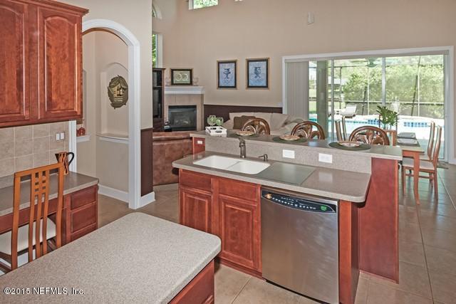 11766 Mandarin Road Jacksonville, FL 32223 - Photo 8 of 20 a kitchen with stainless steel appliances granite countertop a stove a sink and a refrigerator