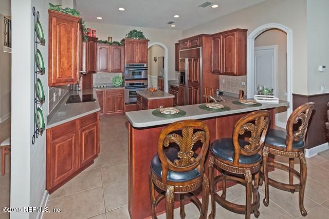 11766 Mandarin Road Jacksonville, FL 32223 - Photo 9 of 20 a kitchen with stainless steel appliances a sink and a refrigerator