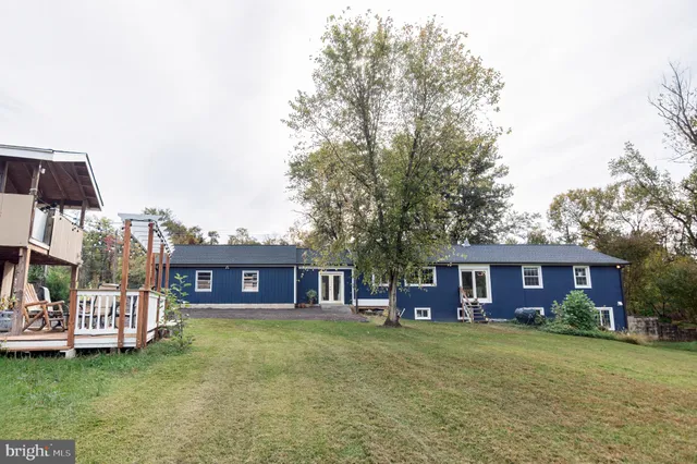 a front view of a house with a garden and porch