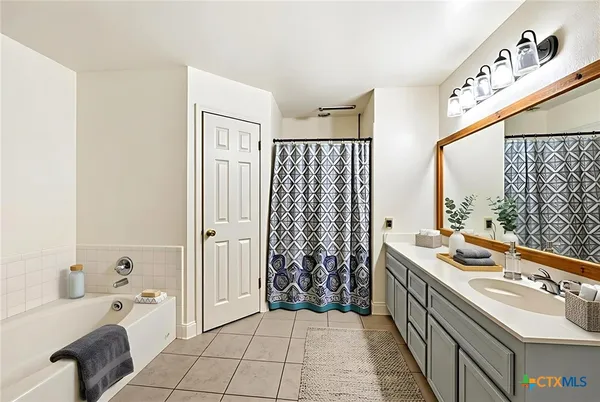a kitchen with a sink and a stove top oven