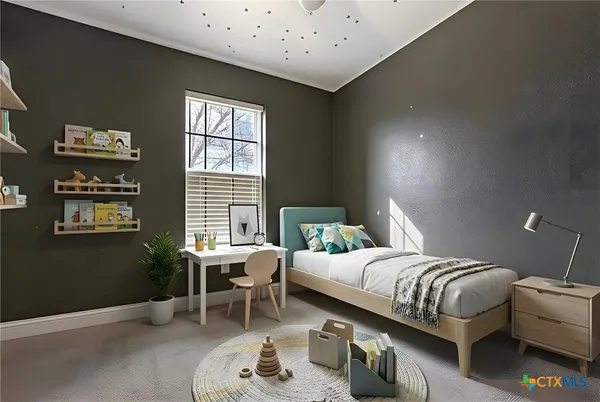 a bedroom with a bed and a window