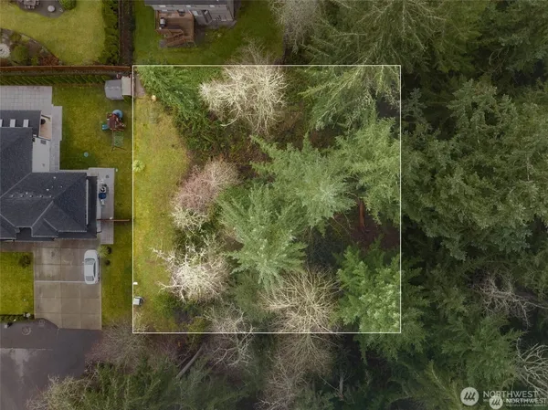 an aerial view of residential house with outdoor space
