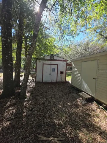 a view of a house with a yard and garage