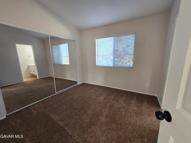 a view of a hallway with a white door
