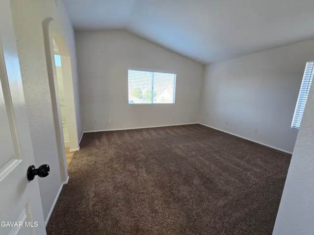 a bathroom with a double vanity sink and mirror