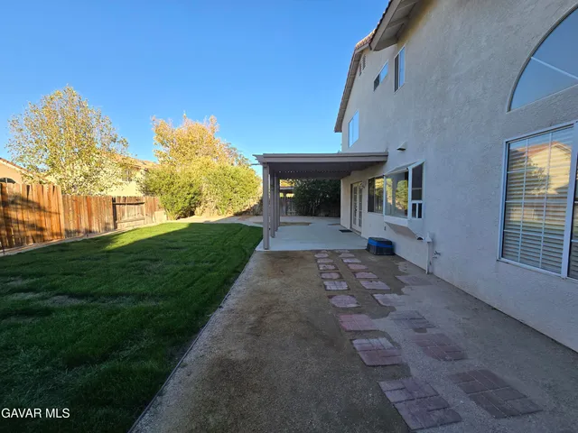 a view of a pathway with a yard