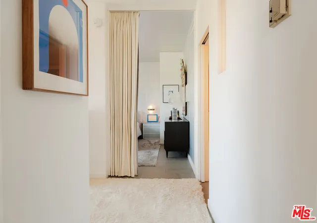 a view of a bathroom with mirror