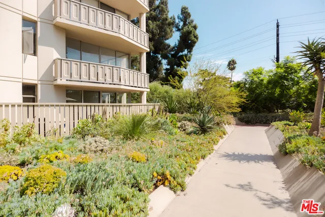 a view of a brick house with a yard