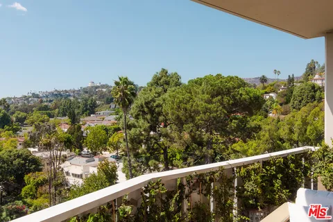a view of a balcony with an outdoor space