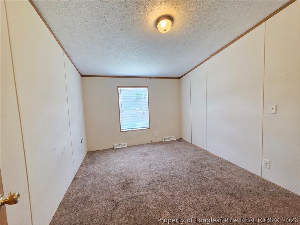 124 Franklin Road Raeford, NC 28376 - Photo 14 of 15 an empty room with windows