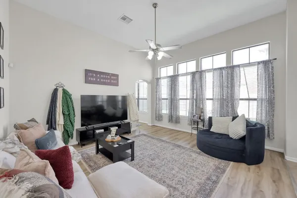 a living room with furniture and a flat screen tv