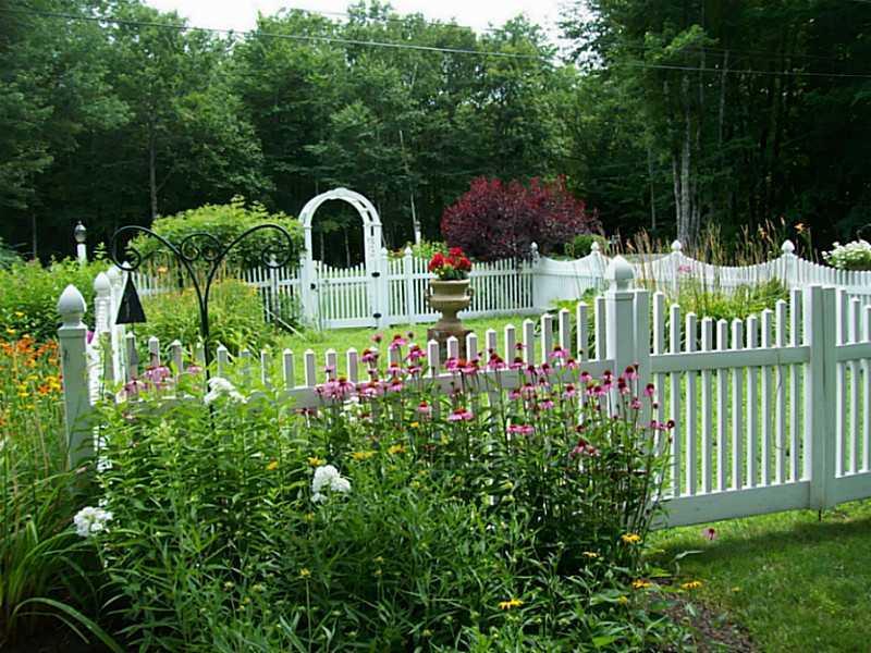 65 Frost Road Lyman, ME 04002 - Photo 10 of 34 Exterior Front. Lanscaped gardens w/...