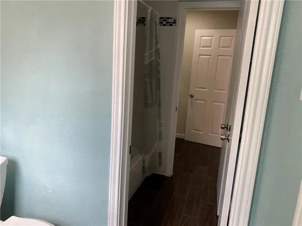 a view of a bathroom from a hallway