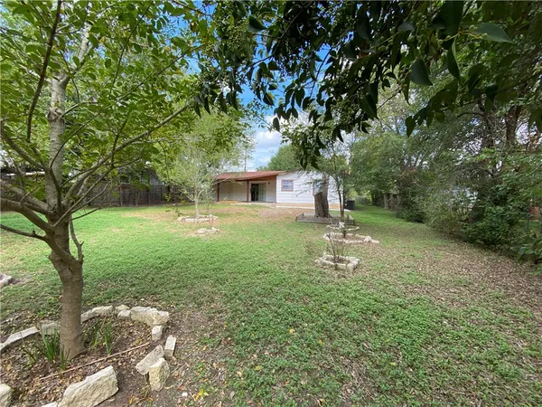 a backyard of a house with lots of green space