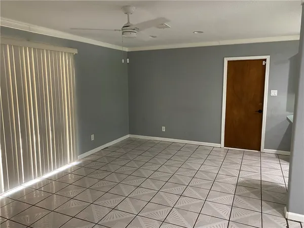 a view of an empty room and window