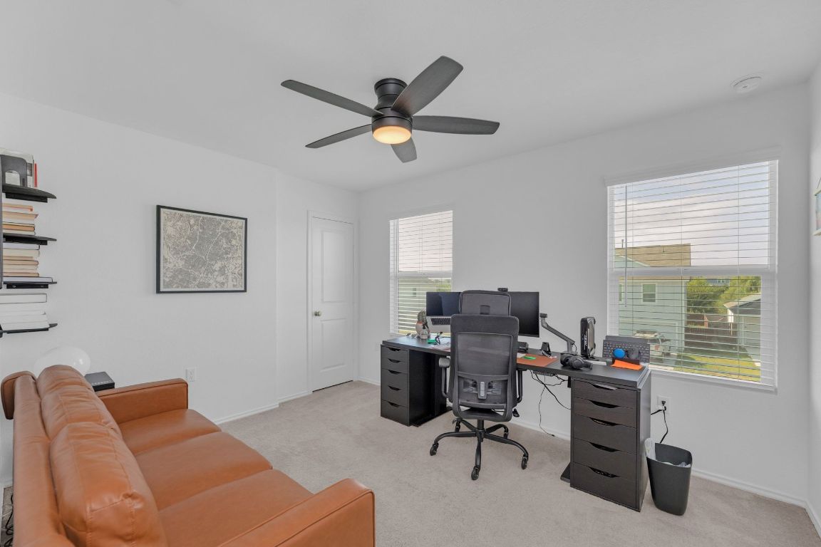2324 Willkomen Way Pflugerville, TX 78660 - Photo 15 of 21 a view of a workspace with furniture and a window