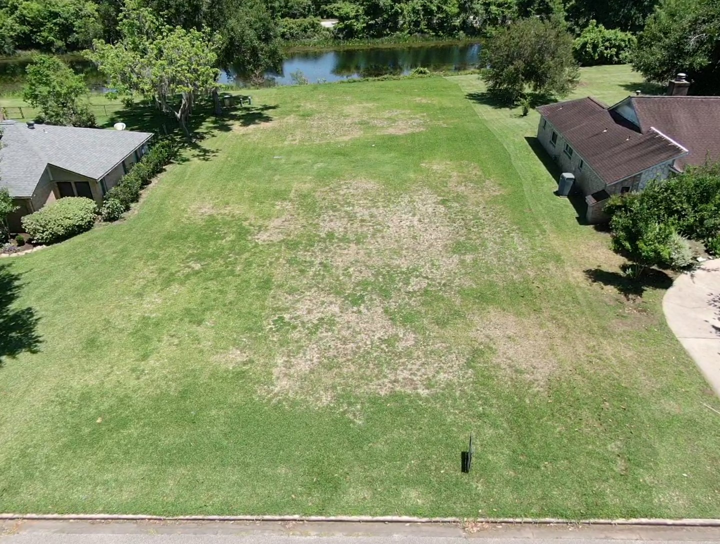 2209 Riverside Drive West Columbia, TX 77486 - Photo 3 of 9 an aerial view of residential houses with outdoor space and trees